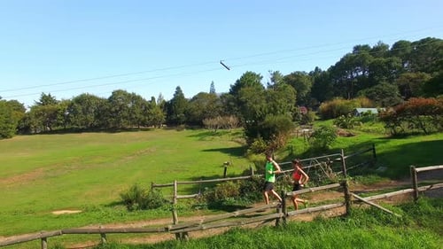 Couple jogging on forest path