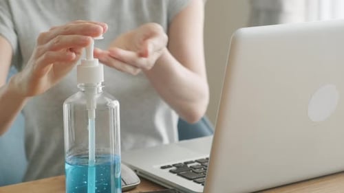 Hand Sanitizer Before Laptop Use at Home