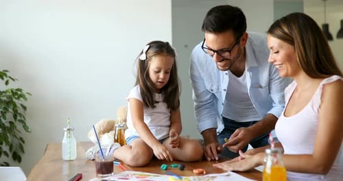 Family Doing Arts and Crafts Together at Home