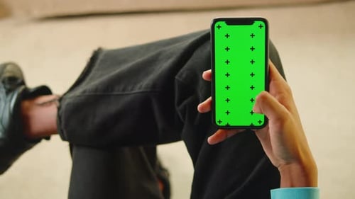 African American Man Using Smartphone with Chroma Key Closeup