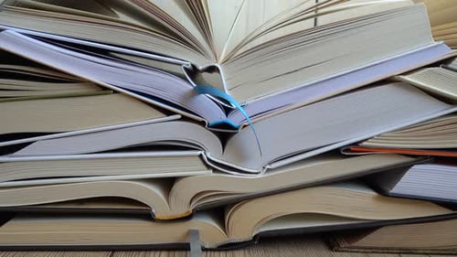 Stack of Open Books Piled High