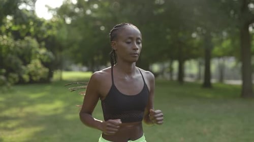 Sporty African American Woman Running Outdoors