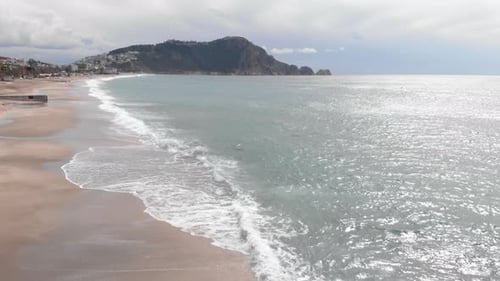 Ocean waves with white foam at stormy windy day
