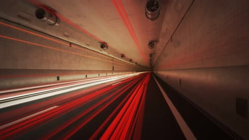 Light trails left by cars in the tunnel. Time stopped but camera is moving. 4K