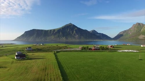 Flying over scenic village Flakstad on Lofoten