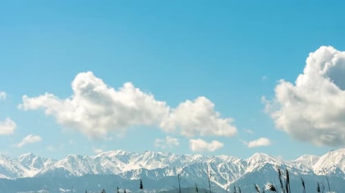 Timelapse Snowy Mountains and Clouds