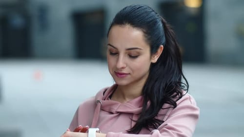 Smiling Woman Touching Smart Watch Screen. Close Up Pretty Girl Looking Message