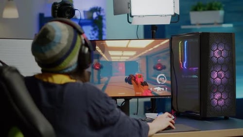 Person Playing a Video Game on Computer