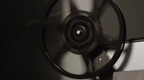 Projector reel spinning as film is loose after playing movie