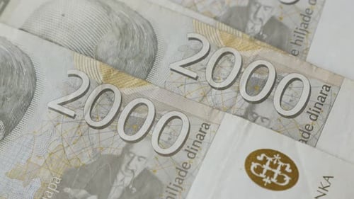 National paper currency of Serbia dinar in 2000 denominations 4K 2160p 30fps UltraHD tilting footage