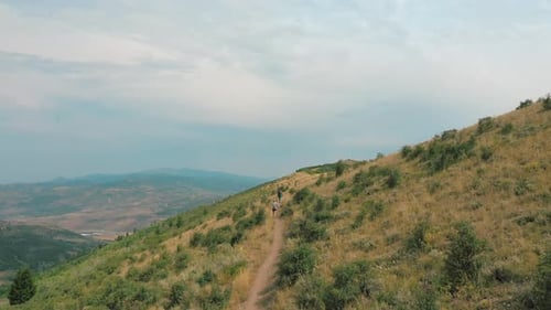Hikers Continue On Walking To Climb The Top Of The Mountain in Park City Utah. -aerial