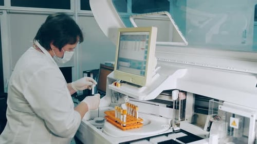 Scientist Analyzing Test Tube Sample in Laboratory