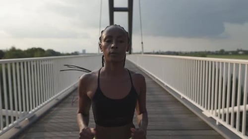 Fit African American Woman Jogging at Urban Area