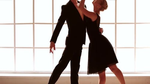 Elegant Couple Ballroom Dancing with Grace and Passion