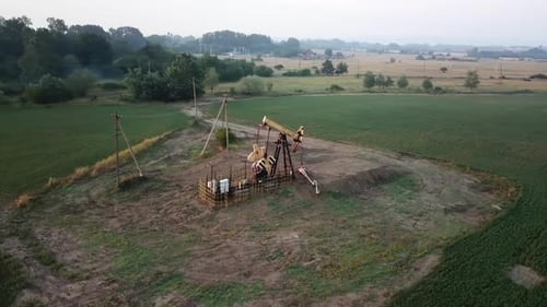 The Oil Pump, Industrial Equipment. Oil Field Site, Oil Pumps Are Running