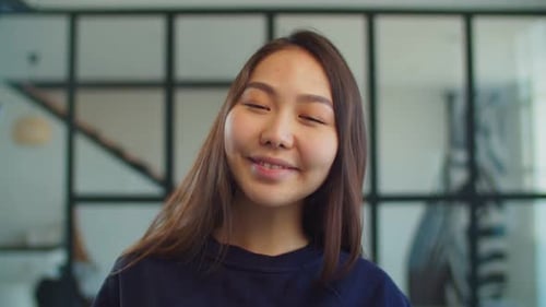 Smiling Woman Posing Indoors