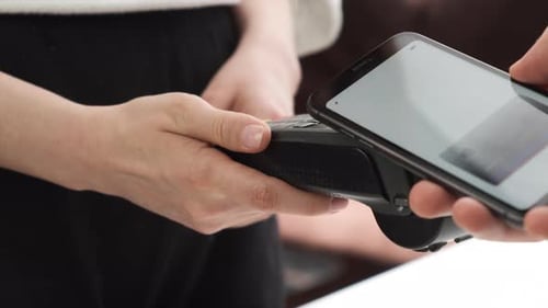 Close Up Man Hand Contactless Paying By Smartphone