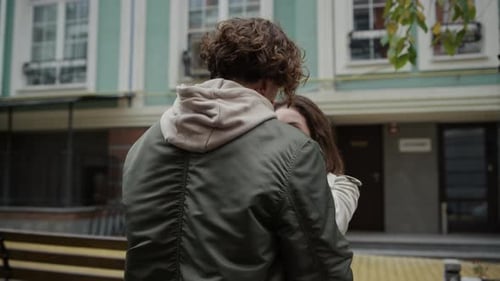 Loving Couple Embrace Affectionately in City Setting