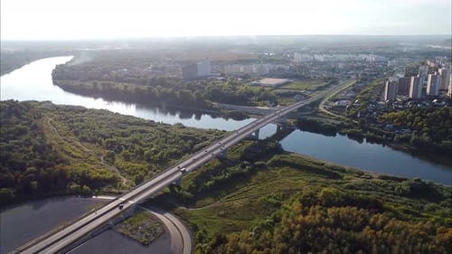 View of the Forest Road Road Bridge Over the River and Urban Residential Highrise Buildings Shooting