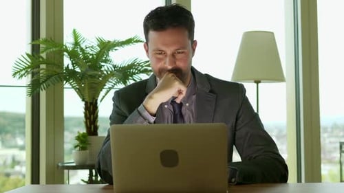 Young Handsome Businessman Working in Modern Office
