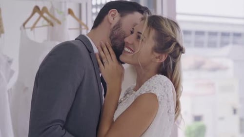 Loving Couple Embracing in Bridal Shop, Wedding Day