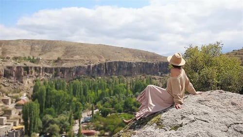 Young Woman on the Edge of Canyon in Cappodocia