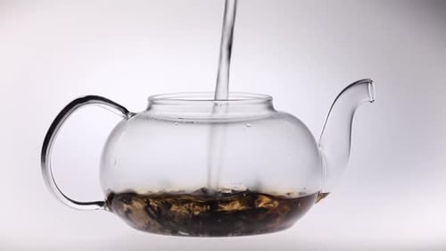 Tea Brewing in Clear Glass Teapot