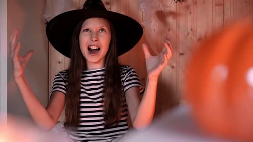 Girl Acting as Witch on Halloween
