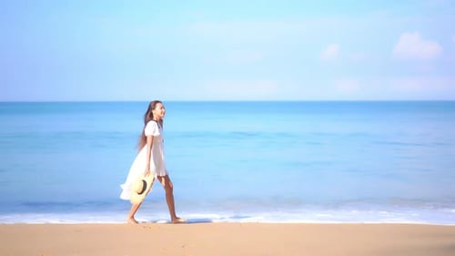 Asian woman enjoy around beautiful beach sea ocean