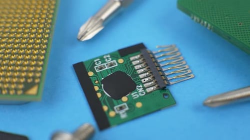 Electronic Green Circuit Board with Microchip and Transistors