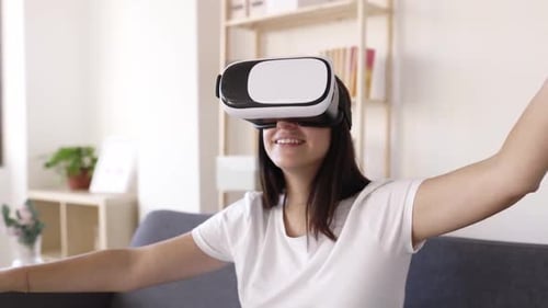 Woman Experiencing Virtual Reality at Home