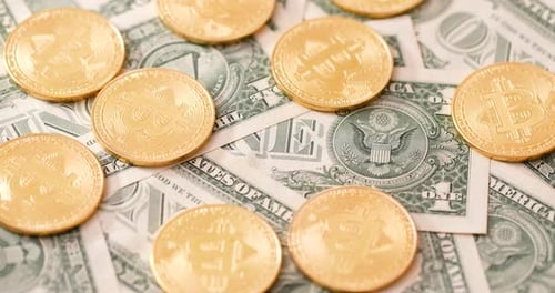 Bitcoin Cryptocurrency Coins and Dollar Bills Close Up