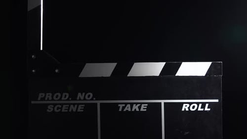 Action Movie Clapboar in Dusk . Close Up. Black Background