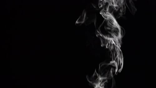 Grey Smoke Rising Against Black Background