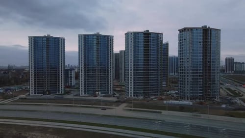 Construction of modern multi-storey buildings. Construction of a new city block.