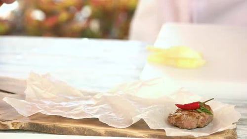 Gourmet Meat Appetizer Preparation with Chili and Herbs