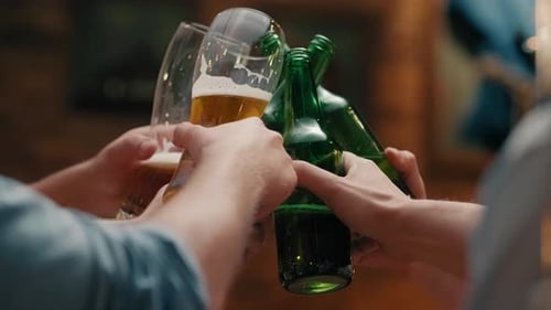 Friend with beer glass making a cheers