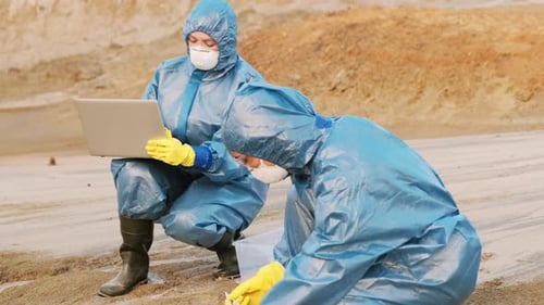 Scientists Collect Water Sample in Rural Setting