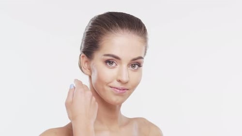 Attractive Woman Touching Her Face in Beauty Portrait