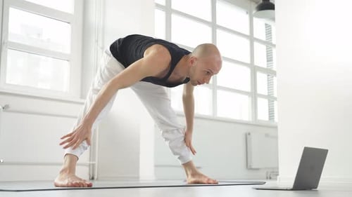 Man Doing Stretching Exercise Routine At Home