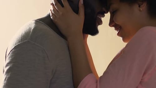 Affectionate Couple Touching Foreheads and Smiling
