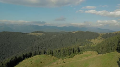 Panoramic View of Majestic Mountains and Cloudy Sky