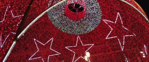 Low angle view of a giant red ball installation for Christmas holiday season.