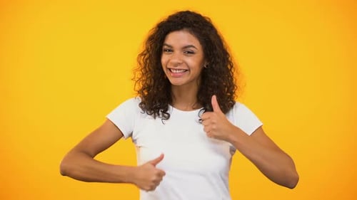 Enthusiastic Woman Giving Thumbs Up