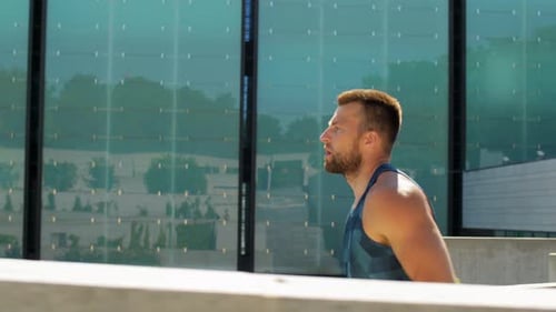 Young Man Running in Urban Environment
