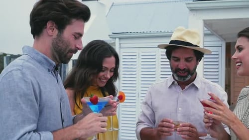 Adults Enjoying Cocktails at a Party