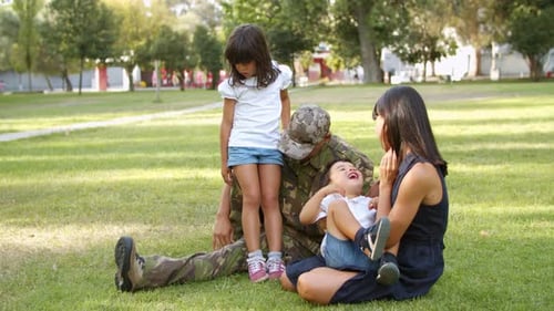 Military Family Enjoying Quality Time in Park