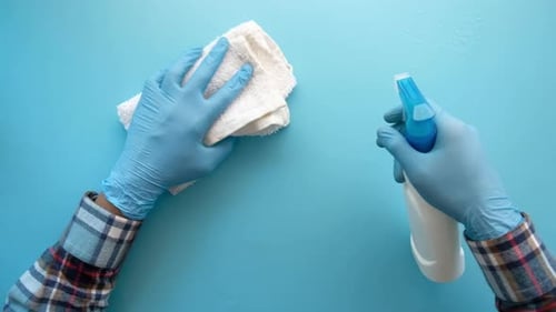 Protective Gloves Clean Surface With Spray And Cloth
