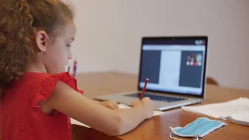 Distance Learning Online Education Schoolgirl Sits at Home at Her Desk Performs a School Assignment