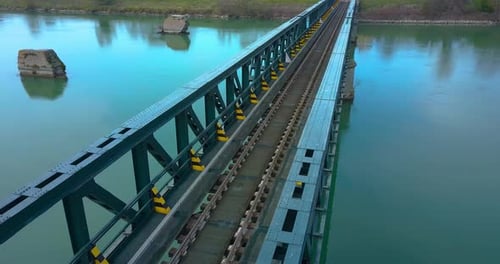 Train Tracks Cross a Steel Bridge
